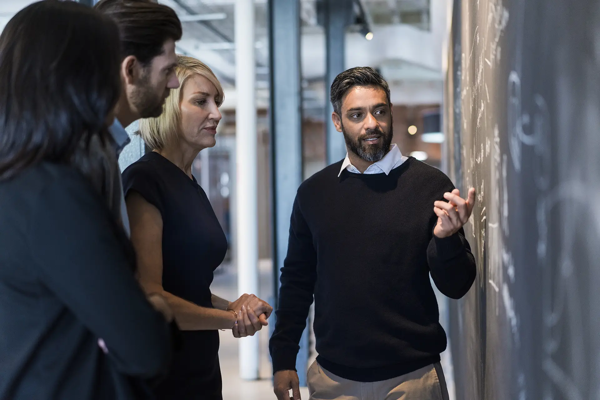 Businessman explaining plan to colleagues