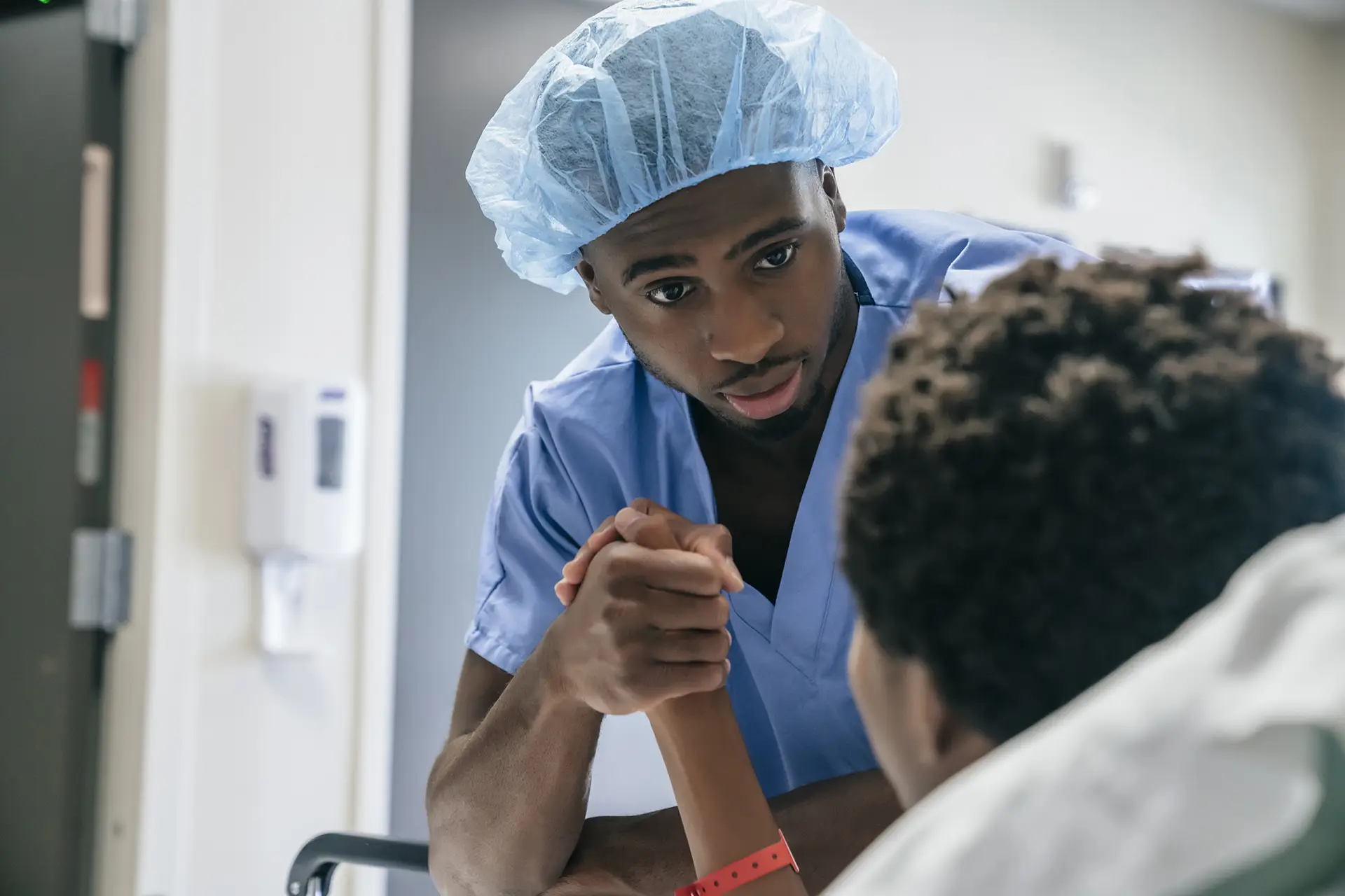 Nurses and Doctor walking in hospital hall